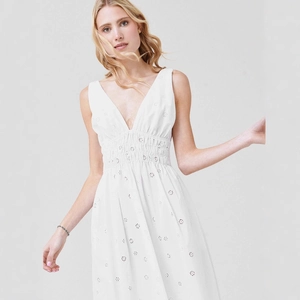 White sleeveless deep V-neck dress with intricate daisy embroidery and cinched waistline