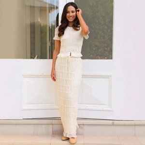 Elegant cream two-piece chiffon set with ruffled textures and buttoned top for women