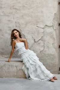 Detailed close-up of layered lace embroidery and hollow patterns on this summer maxi dress