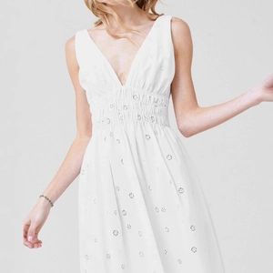 White V-neck sleeveless eyelet embroidery midi dress with smocked waist and elegant flowy hem