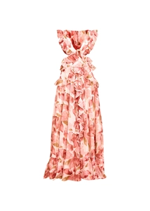 Details von Volants und abstraktem Blumendruck auf einem rosa Chiffon-Urlaubskleid