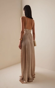 Back view of champagne pleated maxi dress with elegant open back and high waist detail