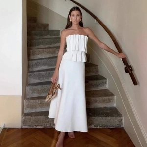 Elegant white strapless evening dress with pleated ruffles and a long A-line skirt