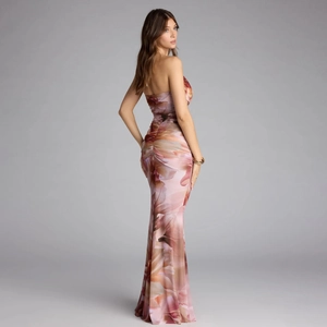 Floral print halter mermaid maxi dress with ruched details and a slim fit silhouette