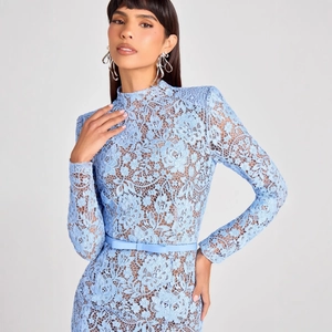 Elegant light blue lace evening gown with long sleeves, high neck and a delicate bow belt