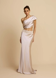 Detail of elegant satin gown featuring one-shoulder bodice and lace waist accents