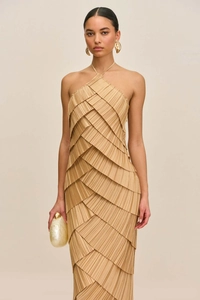 Detailed close-up of champagne tiered pleated evening dress with halter neckline