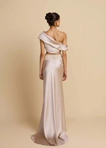 Detailed back view of champagne satin dress with elegant lace waist and one-shoulder top