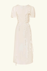 Detail of white V-neck evening gown featuring elegant ruffled puff sleeves and vertical pleats