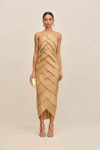 Detailed view of layered pleats and irregular crossover hem of the beige halter midi dress