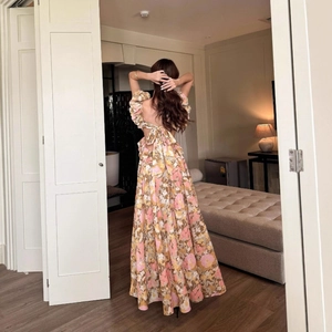 Floral backless maxi dress with large bow detail and elegant puff sleeves for summer