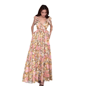 Floral maxi dress with deep V-neck, ruffled shoulders, and waist cut-outs for vacation