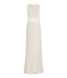 Close-up of sequin embroidery and lace patchwork on a floor-length evening dress