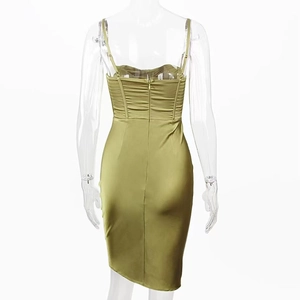 Detailed back view of olive green satin dress featuring ruching and invisible zipper