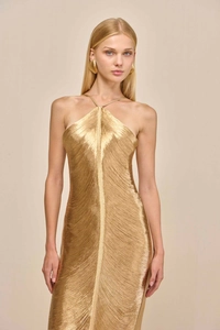 Detail of gold metallic fringe halter dress with shimmering draped tassel texture