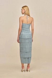 Back view of a tiered pleated evening dress with halter neck and strapless detail