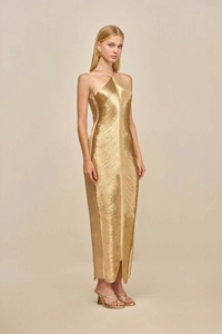 Detail of elegant gold halter maxi dress with flowing tassel fringe and metallic luster