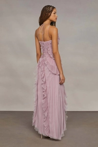 Macro detail of the ruffled chiffon texture and elegant backless cross-tie design