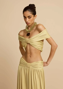 Detail of knot twist drape on off-shoulder top and high waist matching maxi skirt set