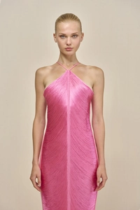 Detail of hot pink halter neck dress featuring dense flowing fringe and textured fabric