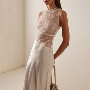 Elegant sleeveless evening gown with sequined mesh, lace cutouts and sleek satin skirt