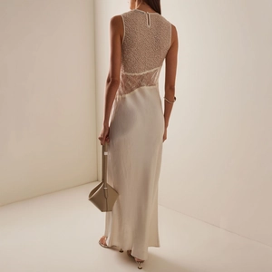Elegant back view of ivory lace evening gown with sequined embroidery and satin skirt