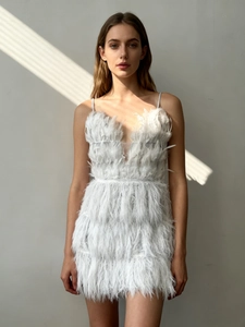 Detail of white feather mini dress with deep V-neck and delicate spaghetti straps