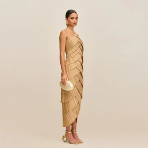 Elegant sleeveless halter evening gown with tiered pleated design in champagne gold