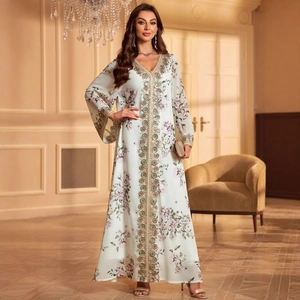 Detail of embroidered neckline on long sleeve white floral kaftan dress for women
