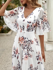 Close-up of elegant V-neck floral dress with pink peony print and ruffle sleeves