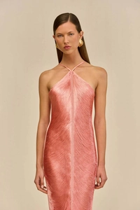 Close-up of coral halter dress featuring delicate layered fringes and silky texture details