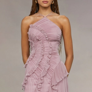 Pink pleated halter maxi dress with cascading ruffles and refined cross-neck straps