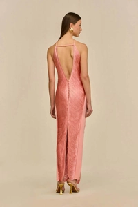 Detail of elegant backless evening dress with fringes, halter neck and deep V-back