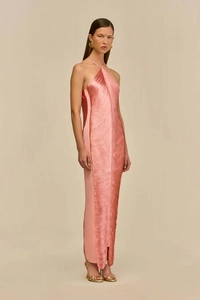 Detail of coral peach halter dress featuring dense fringe textures and side slit design