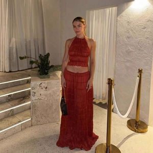 Rust red halter crop top and pleated maxi skirt two-piece set for elegant evening events