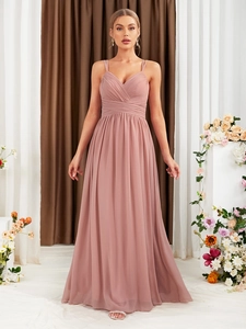 Close-up of dusty rose evening dress featuring pleated waist and elegant chiffon fabric