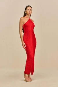 Detail of red halter neck dress featuring dense fringe texture and sleek open back design