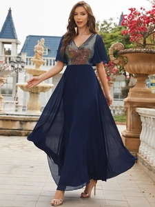 Detail of navy blue V-neck evening gown with colorful sequins and butterfly sleeves