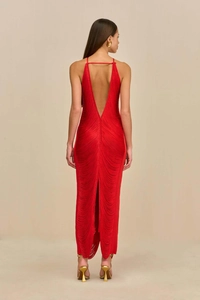 Deep V backless detail of a red maxi dress with elegant swaying fringe and thin straps