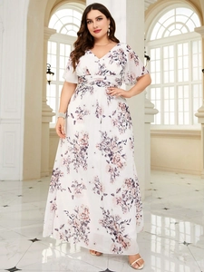 Detail of floral plus size maxi dress featuring delicate lilac print and flutter sleeves