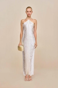 Detailed view of white halter dress featuring vertical fringe texture and slim fit design
