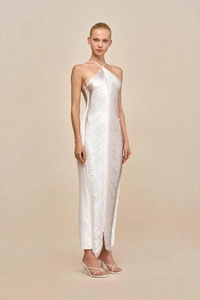 Detail of the white halter neck dress featuring tiered fringe layers and a side split