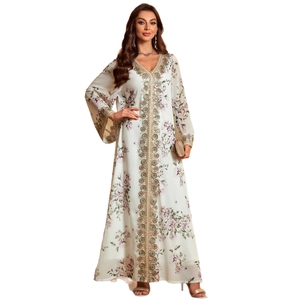 Elegant floral print long sleeve V-neck maxi dress with gold embroidery on white background