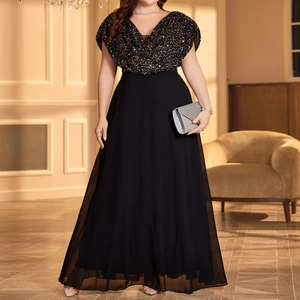 Elegant plus size black V-neck evening gown with gold sequins and flowing chiffon skirt