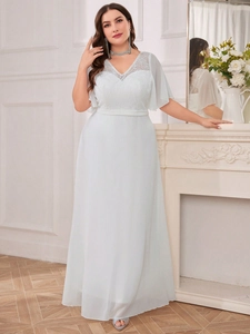 Detail of elegant V-neck lace bodice and embroidery on light blue chiffon evening dress
