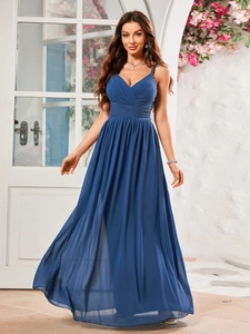 Detail of elegant navy blue V-neck long dress featuring pleated waist and flowy A-line skirt