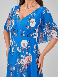 Detailed close-up of blue floral chiffon dress featuring V-neck and butterfly sleeves