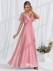 Detailed close-up of pink V-neck maxi dress with delicate Swiss Dot texture and flutter sleeves