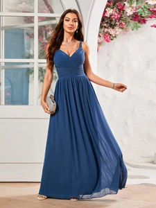 Detailed view of the dark blue evening gown with pleated cross-V neck and thin straps