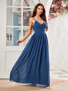 Close-up of elegant royal blue pleated chiffon fabric on a V-neck evening gown